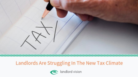 Hand writing the word tax