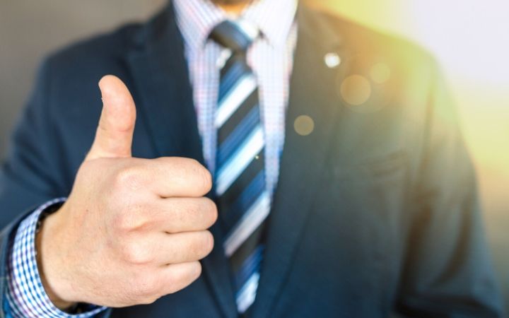 thumb up man in suit