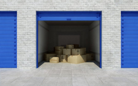 Open self storage unit full of cardboard boxes. 3d rendering