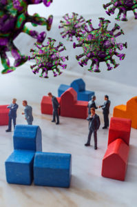 models of business men, houses and coronavirus