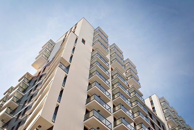 modern, luxury apartment building against blue sky