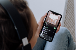 a person listening to music on Spotify