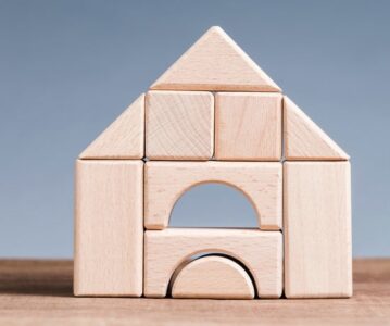 Wooden blocks toy built as a house on the table