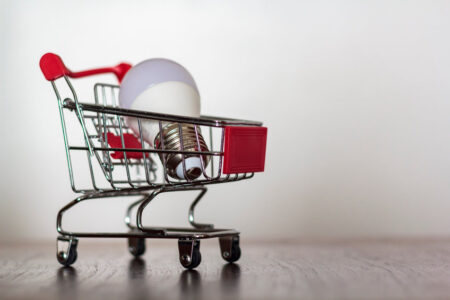 Shopping cart with led lamp on wooden table