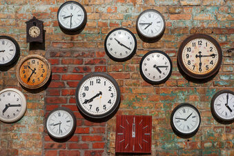Old clocks on brick wall