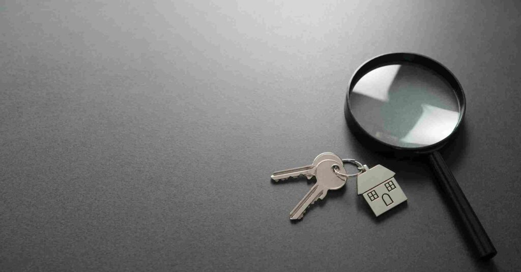 A magnifying glass next to some keys