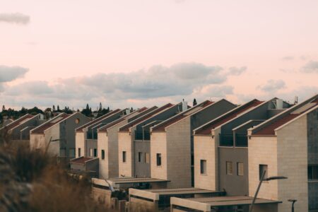 row of houses against cloudy sky