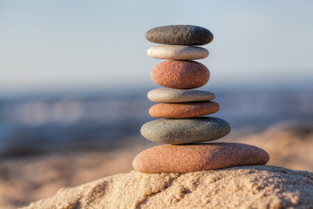 Pyramid of rocks on a sandy beach