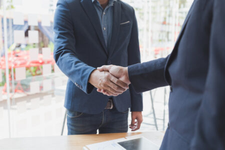 businessman handshaking after meeting in office - teamwork, coop