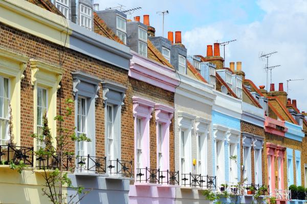 A row of colourful terraced UK properties